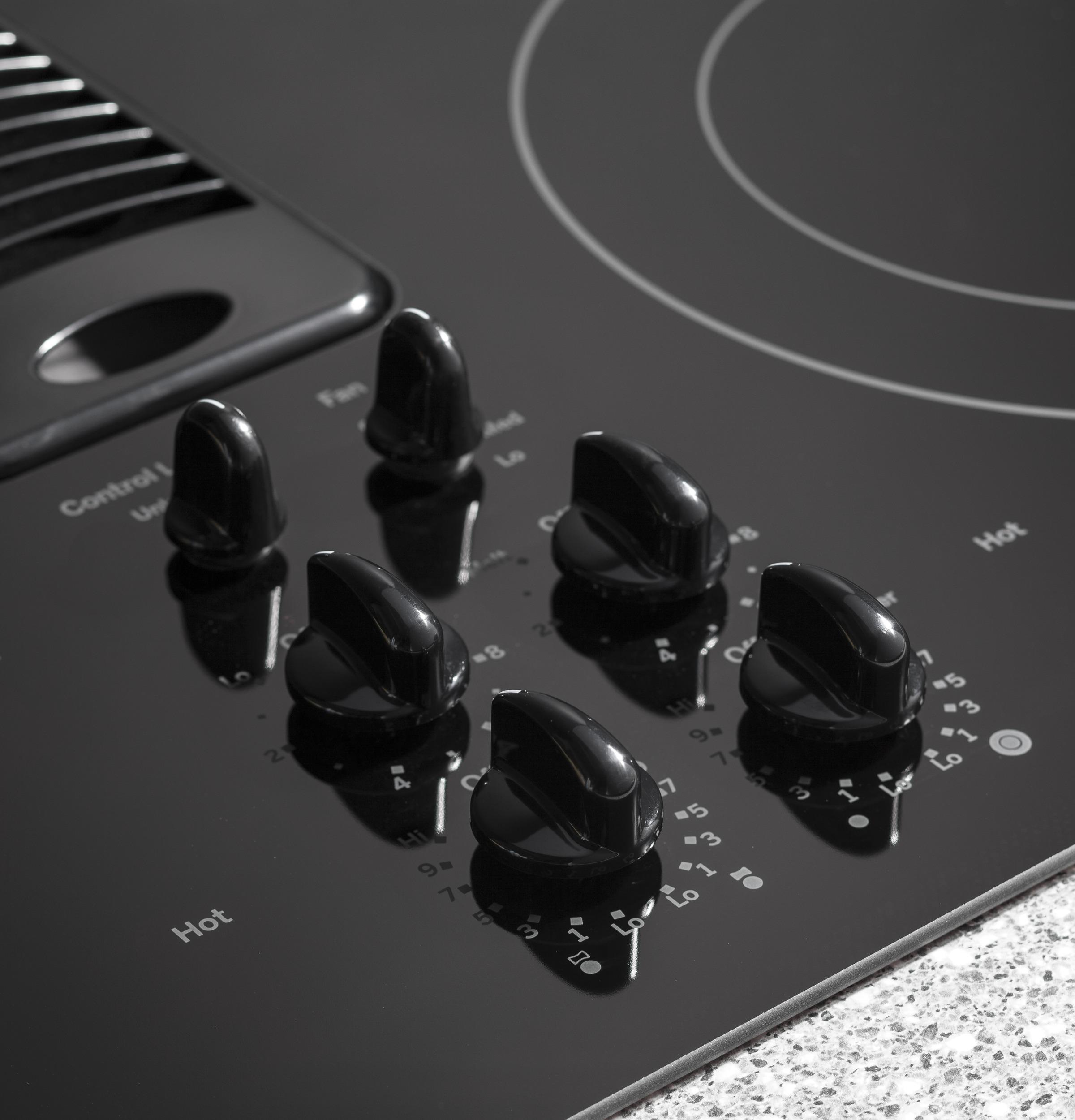Knob controls with black glass surface